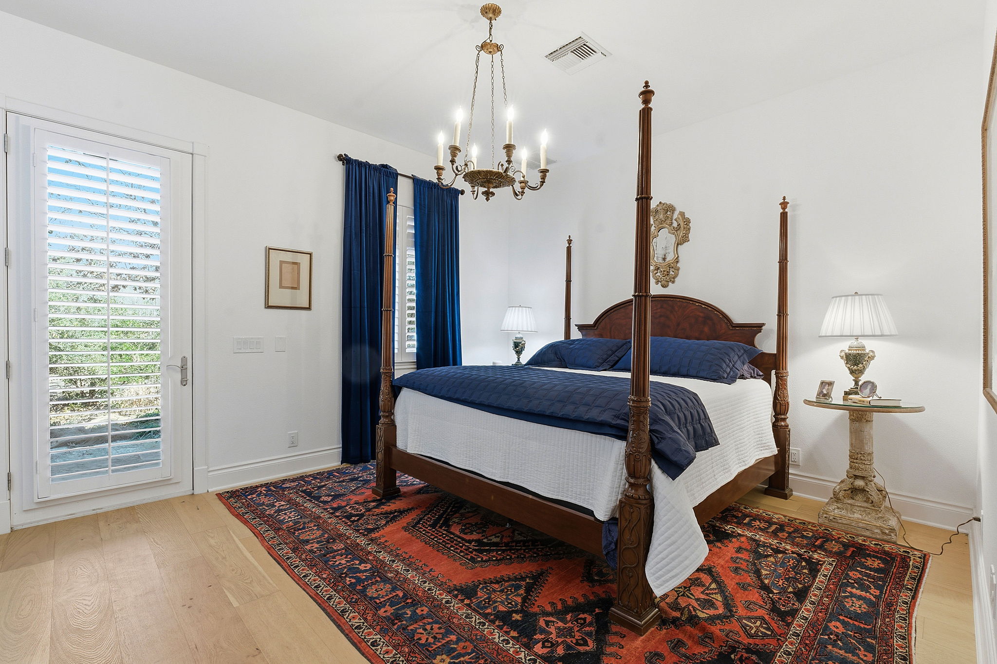 16400 Hamilton Pool Road Austin, TX 78738 - Photo 17 of 37 a bedroom with a bed dresser and a window