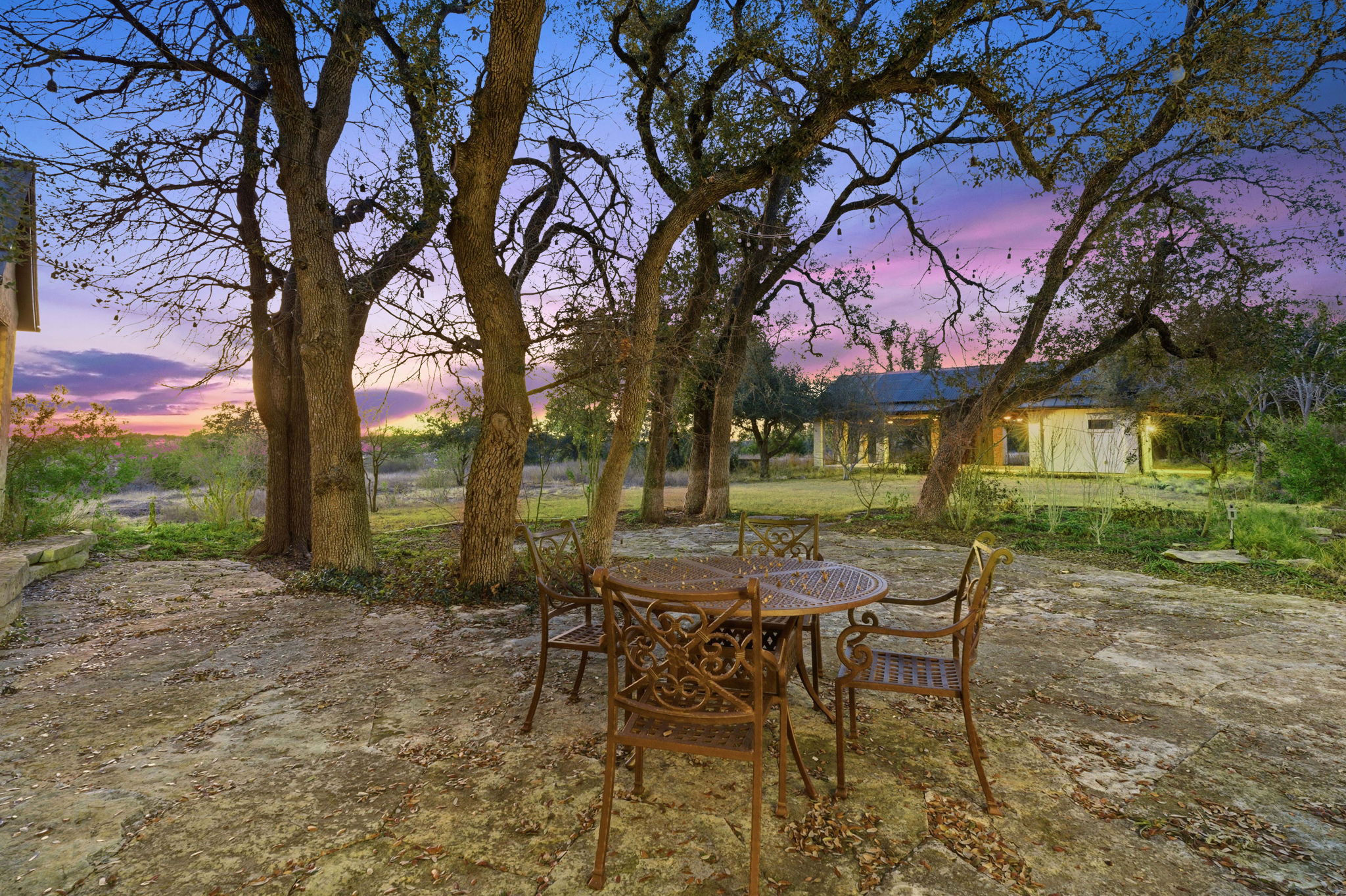 16400 Hamilton Pool Road Austin, TX 78738 - Photo 28 of 37 a view of a chairs and table in the yard