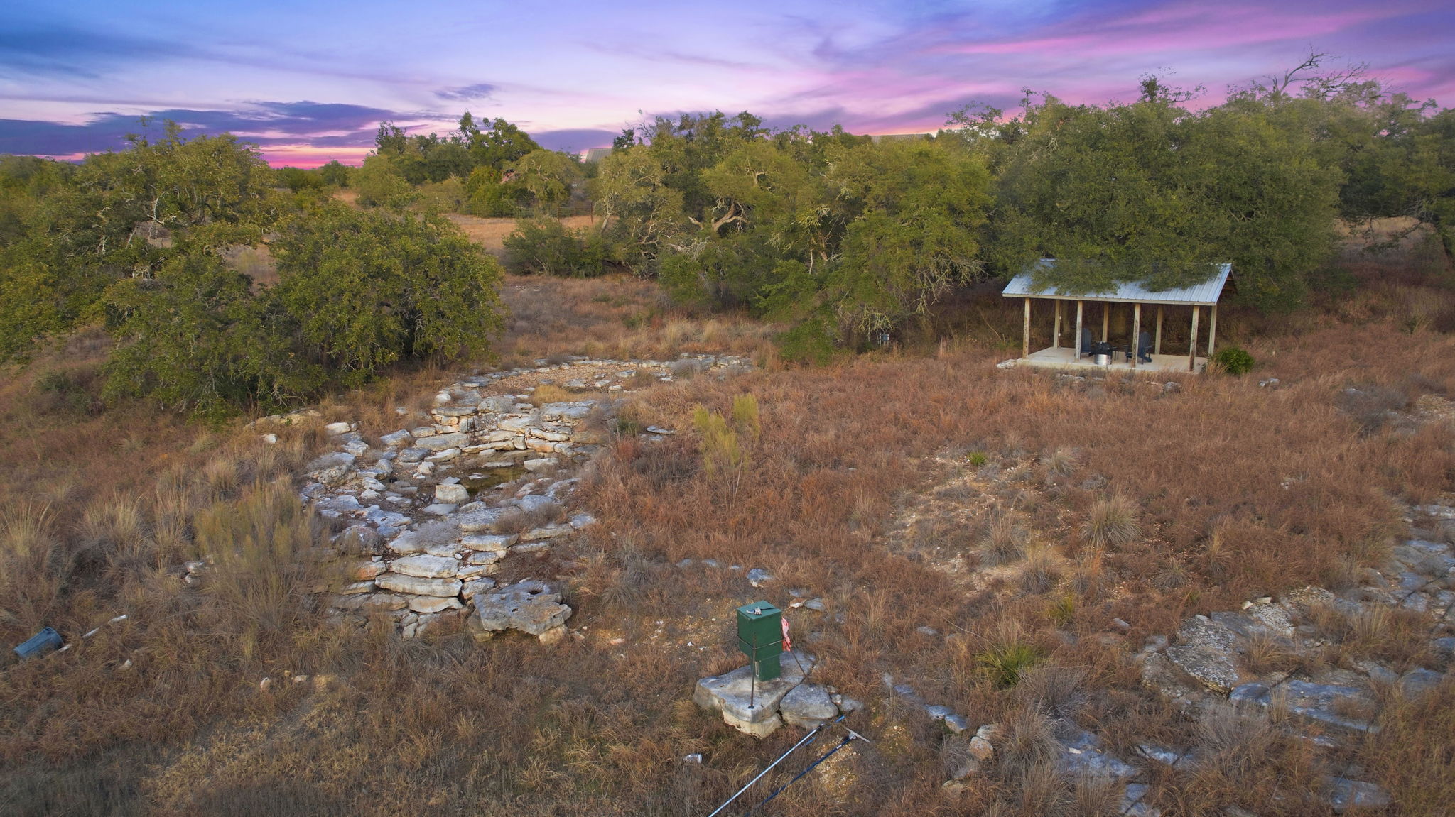 16400 Hamilton Pool Road Austin, TX 78738 - Photo 33 of 37 a view of a house with a yard