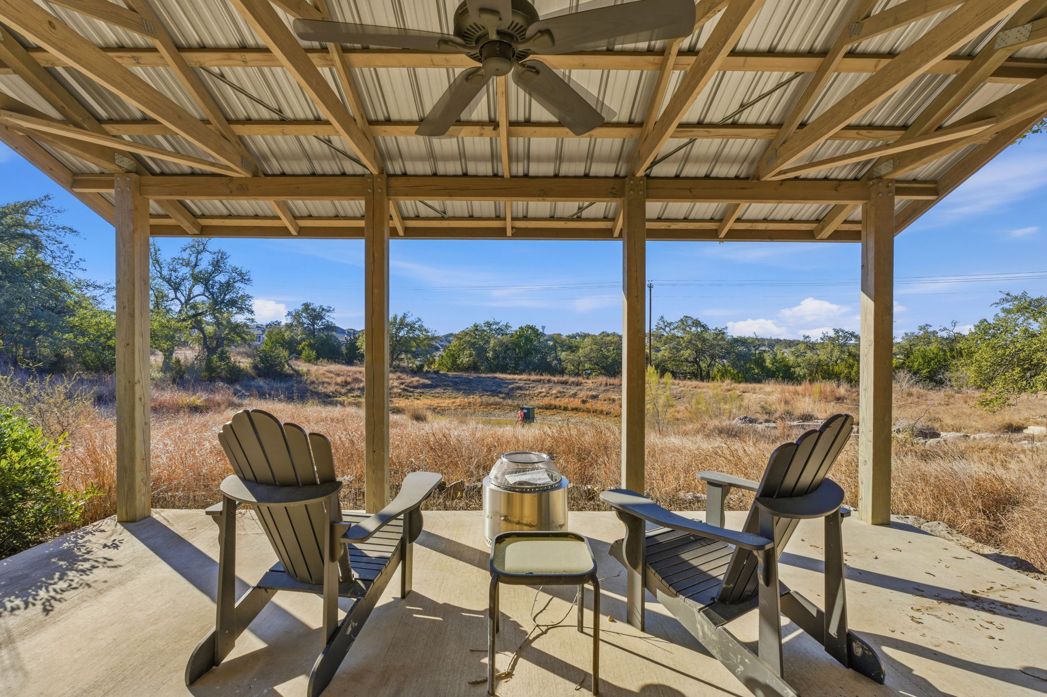16400 Hamilton Pool Road Austin, TX 78738 - Photo 34 of 37 a view of a chairs and table in the patio