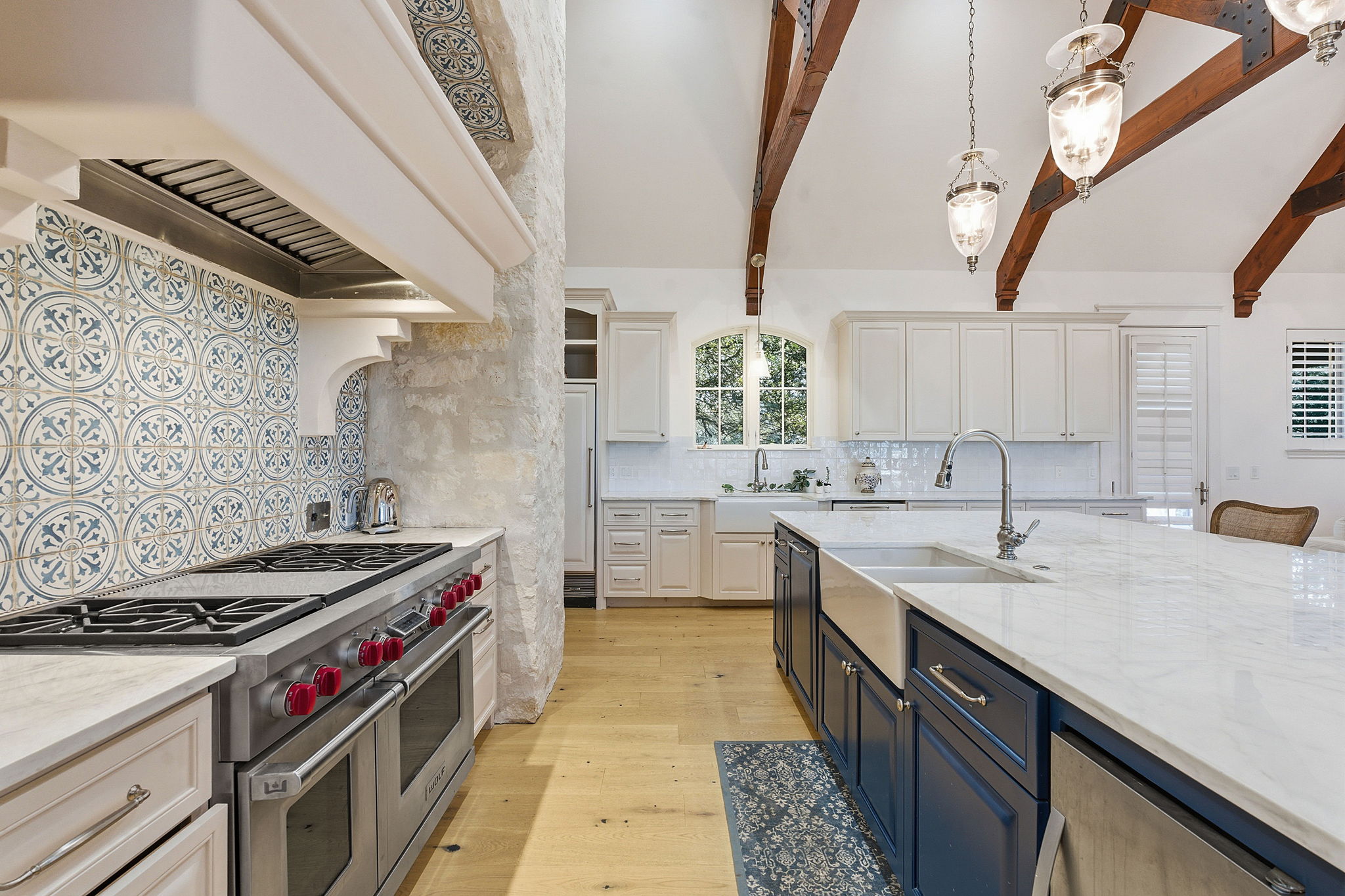 16400 Hamilton Pool Road Austin, TX 78738 - Photo 6 of 37 a kitchen with a sink stove and cabinets
