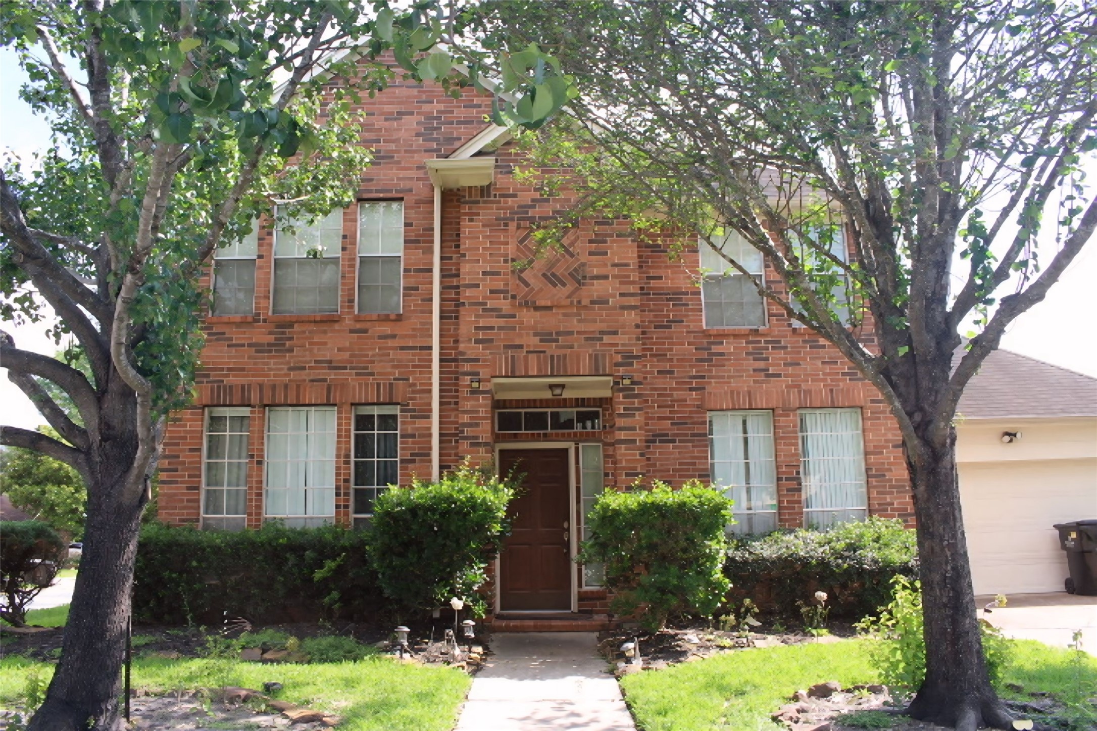 4103 Sablemist Court Houston, TX 77014 - Photo 2 of 29 a front view of a house with yard and green space