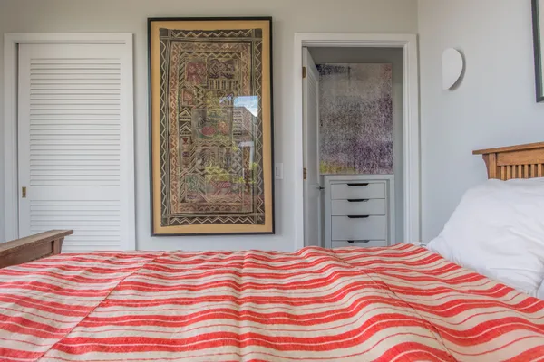 a bedroom with a bed and window