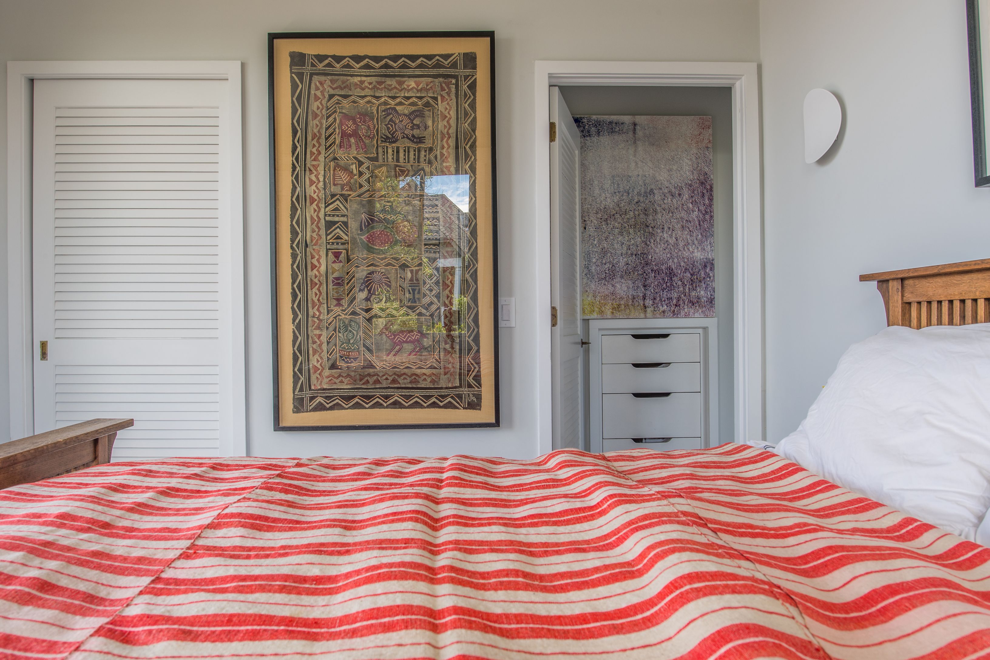 383 Cranberry Hole Road Amagansett, NY 11930 - Photo 11 of 32 a bedroom with a bed and a window