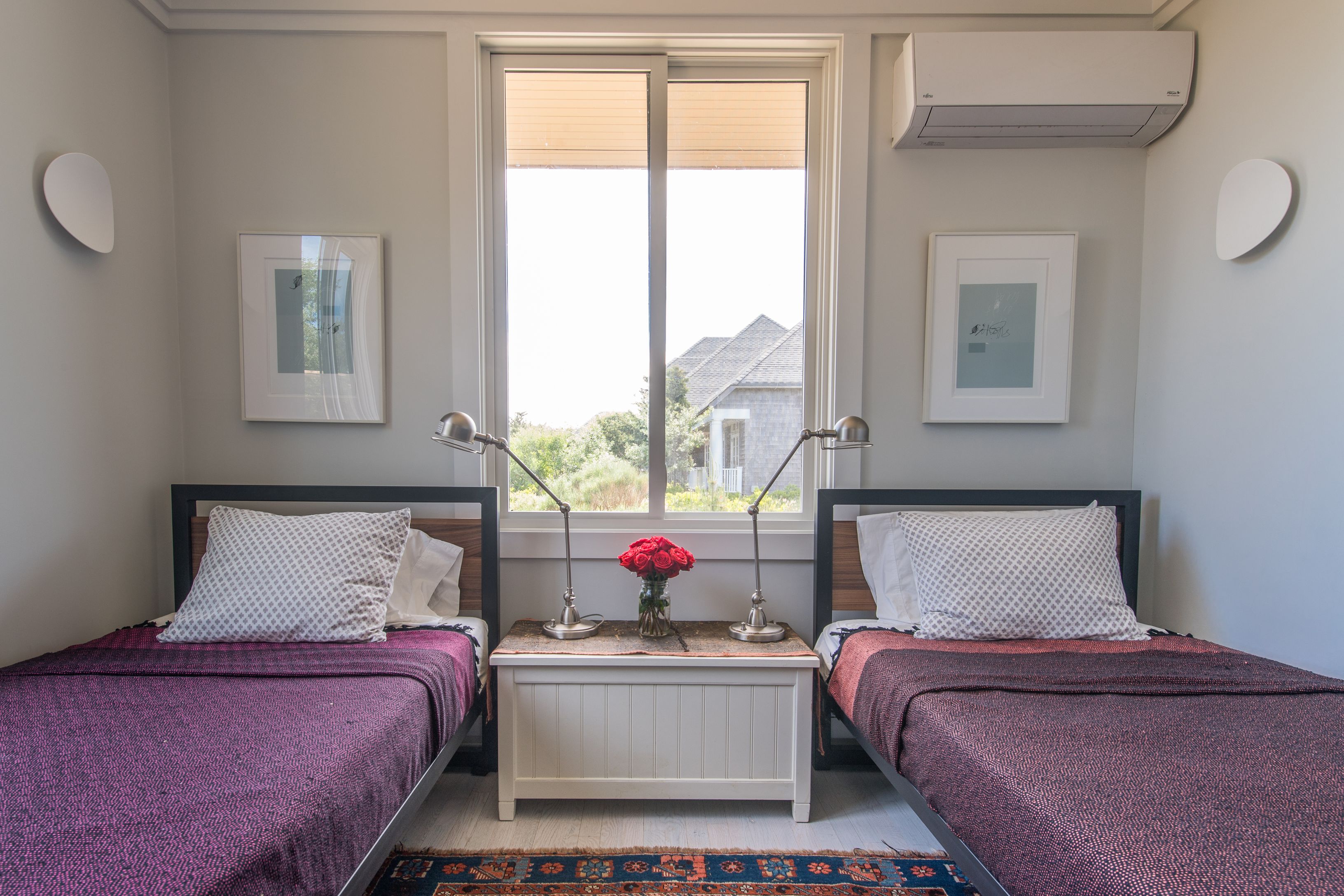 383 Cranberry Hole Road Amagansett, NY 11930 - Photo 12 of 32 a bedroom with a bed and window
