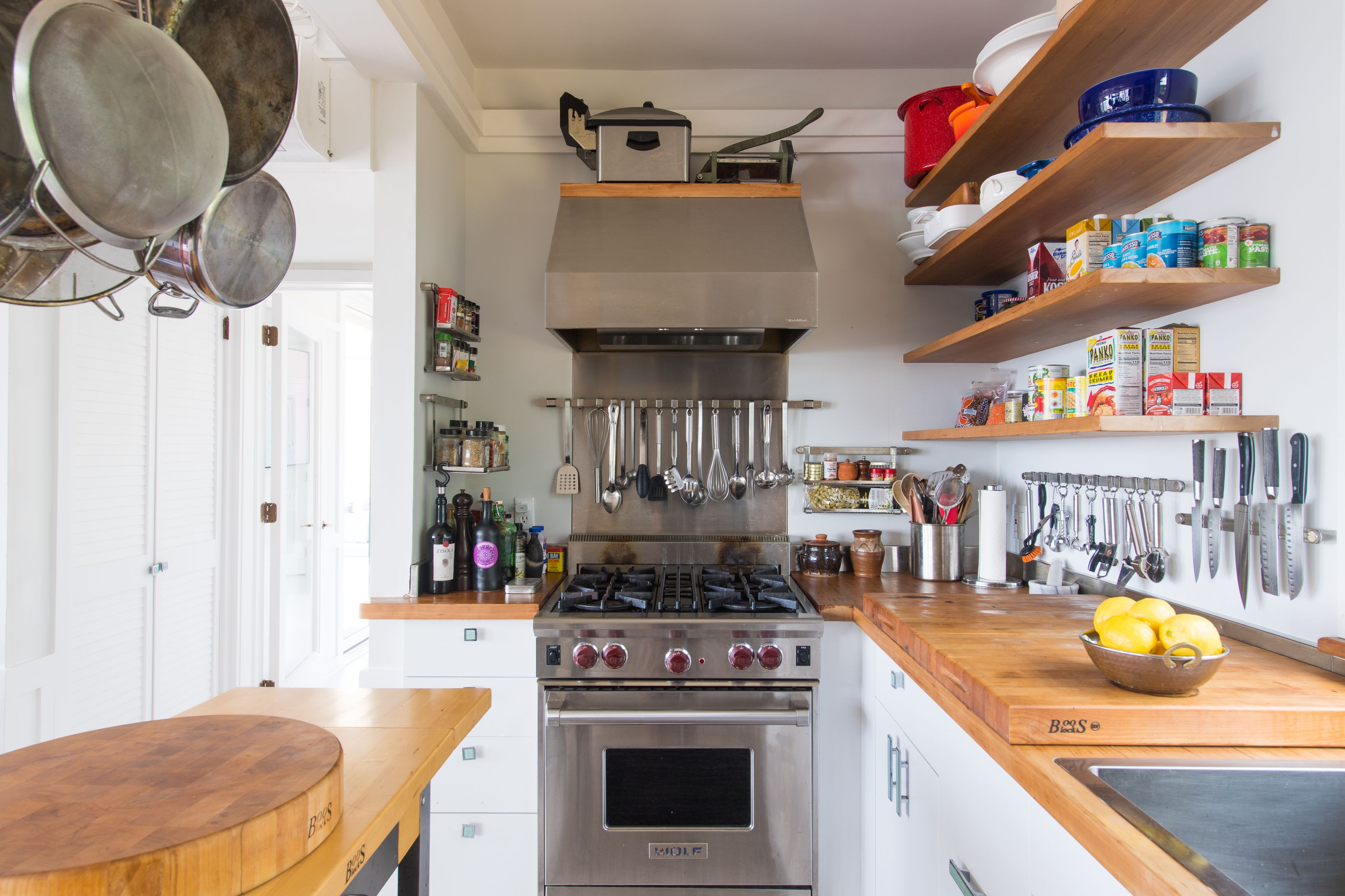 383 Cranberry Hole Road Amagansett, NY 11930 - Photo 13 of 32 a kitchen with a stove and a wooden floor