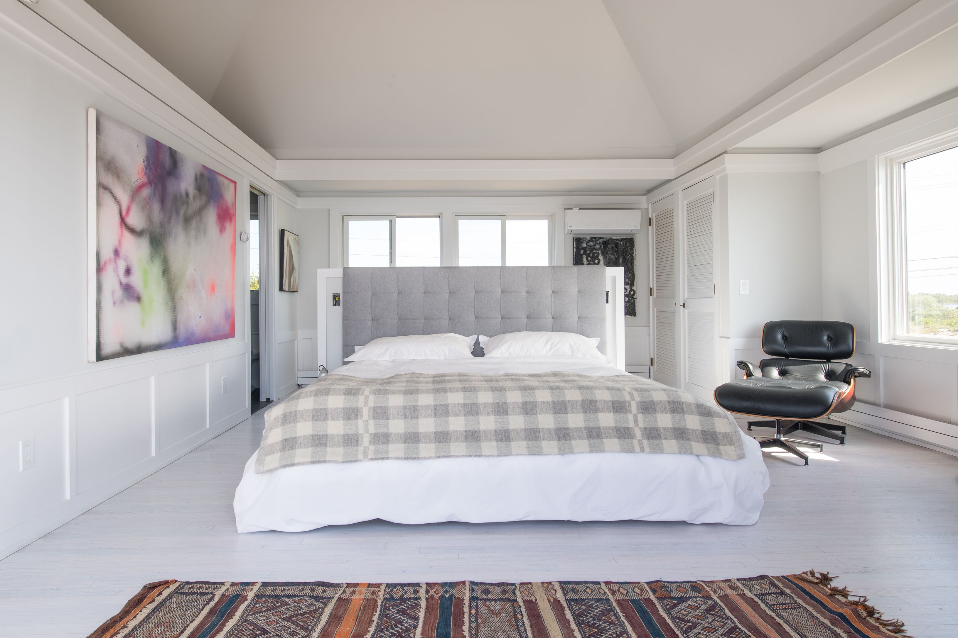 383 Cranberry Hole Road Amagansett, NY 11930 - Photo 17 of 32 a bedroom with a bed and a couch