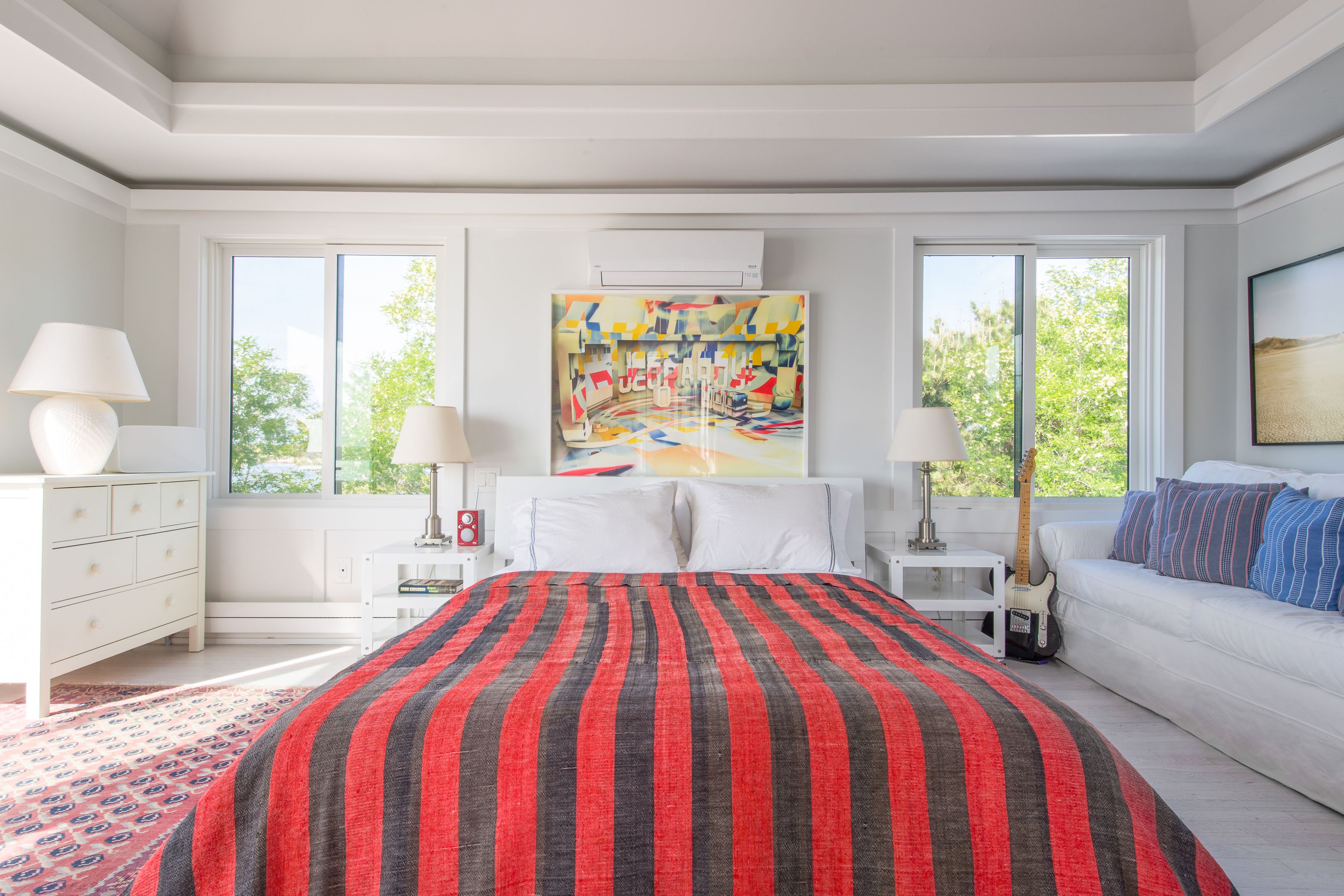 383 Cranberry Hole Road Amagansett, NY 11930 - Photo 20 of 32 a bedroom with a bed and a flat screen tv