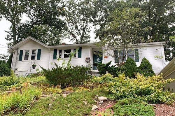 23 Grove Road Natick, MA 01760 - Photo 14 of 14 a front view of a house with garden