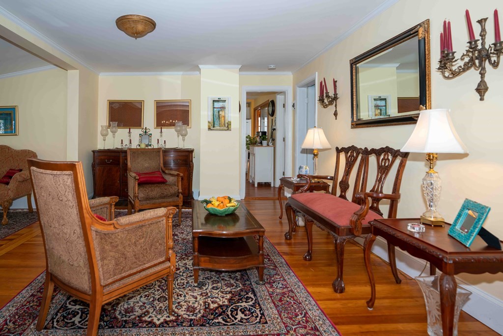 23 Grove Road Natick, MA 01760 - Photo 3 of 14 a living room with furniture and a flat screen tv