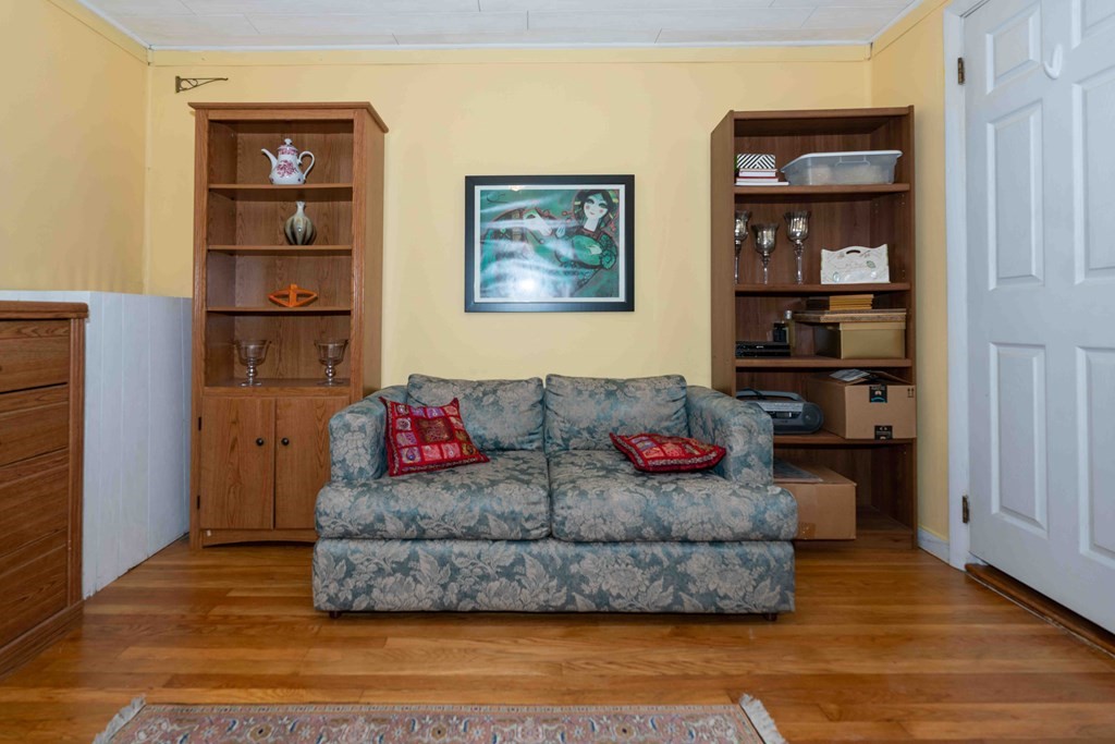 23 Grove Road Natick, MA 01760 - Photo 5 of 14 a living room with furniture and a wooden floor