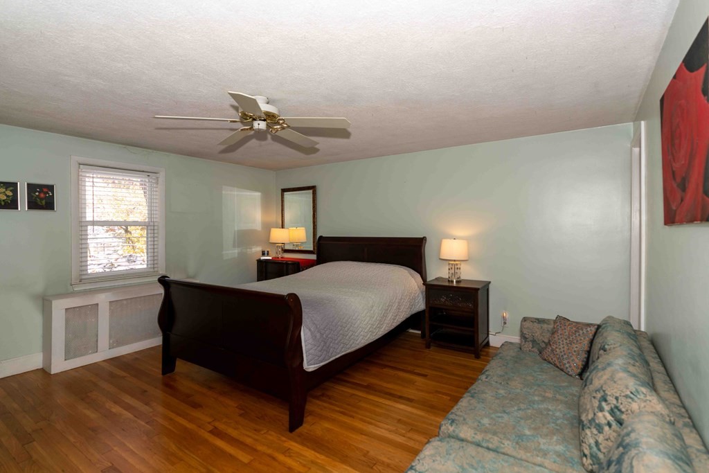 23 Grove Road Natick, MA 01760 - Photo 6 of 14 a bedroom with a bed and window