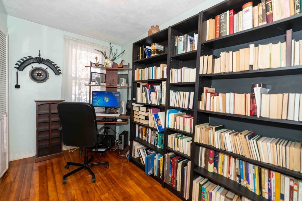 23 Grove Road Natick, MA 01760 - Photo 7 of 14 a view of a workspace with bookshelf