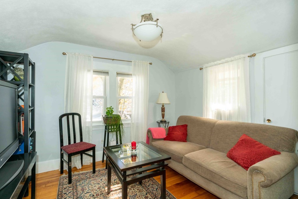 23 Grove Road Natick, MA 01760 - Photo 9 of 14 a living room with furniture and a window