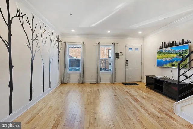 a view of entryway with wooden floor