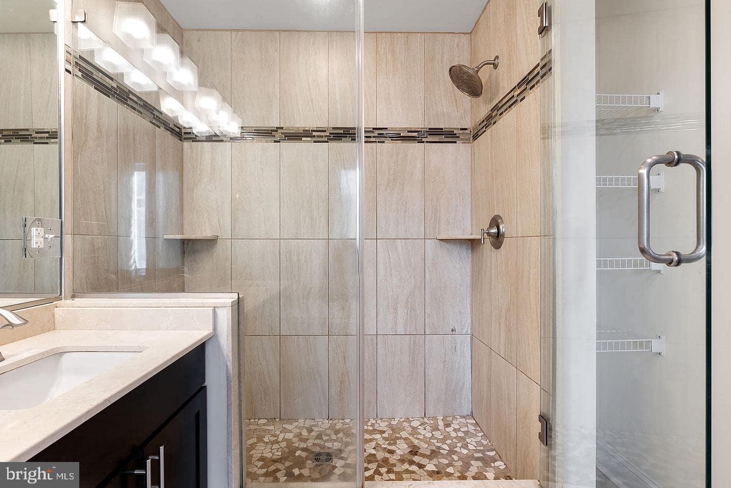 1347 South 20th Street, Unit A Philadelphia, PA 19146 - Photo 11 of 21 a bathroom with a sink and a shower