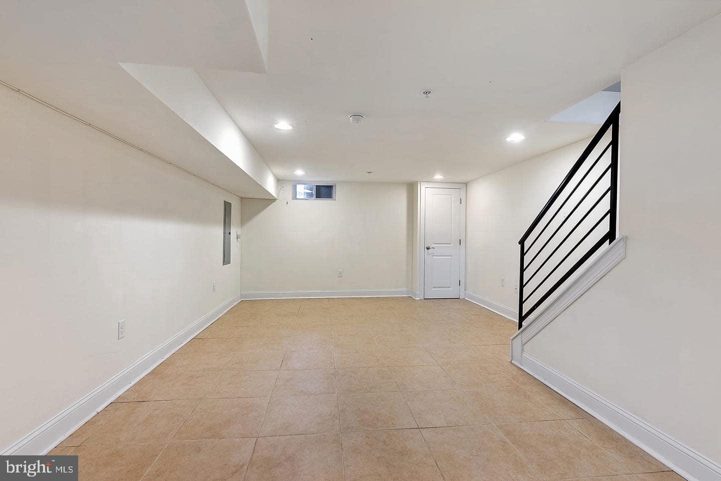 1347 South 20th Street, Unit A Philadelphia, PA 19146 - Photo 16 of 21 an empty room with a projector and windows