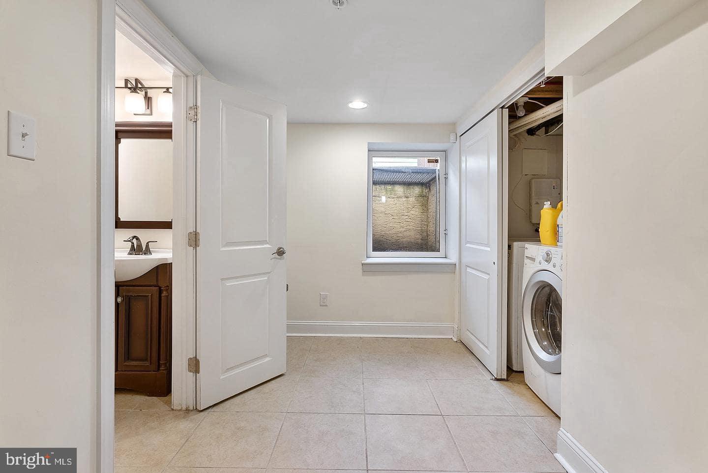 1347 South 20th Street, Unit A Philadelphia, PA 19146 - Photo 17 of 21 a view of a storage & utility room with washer and dryer
