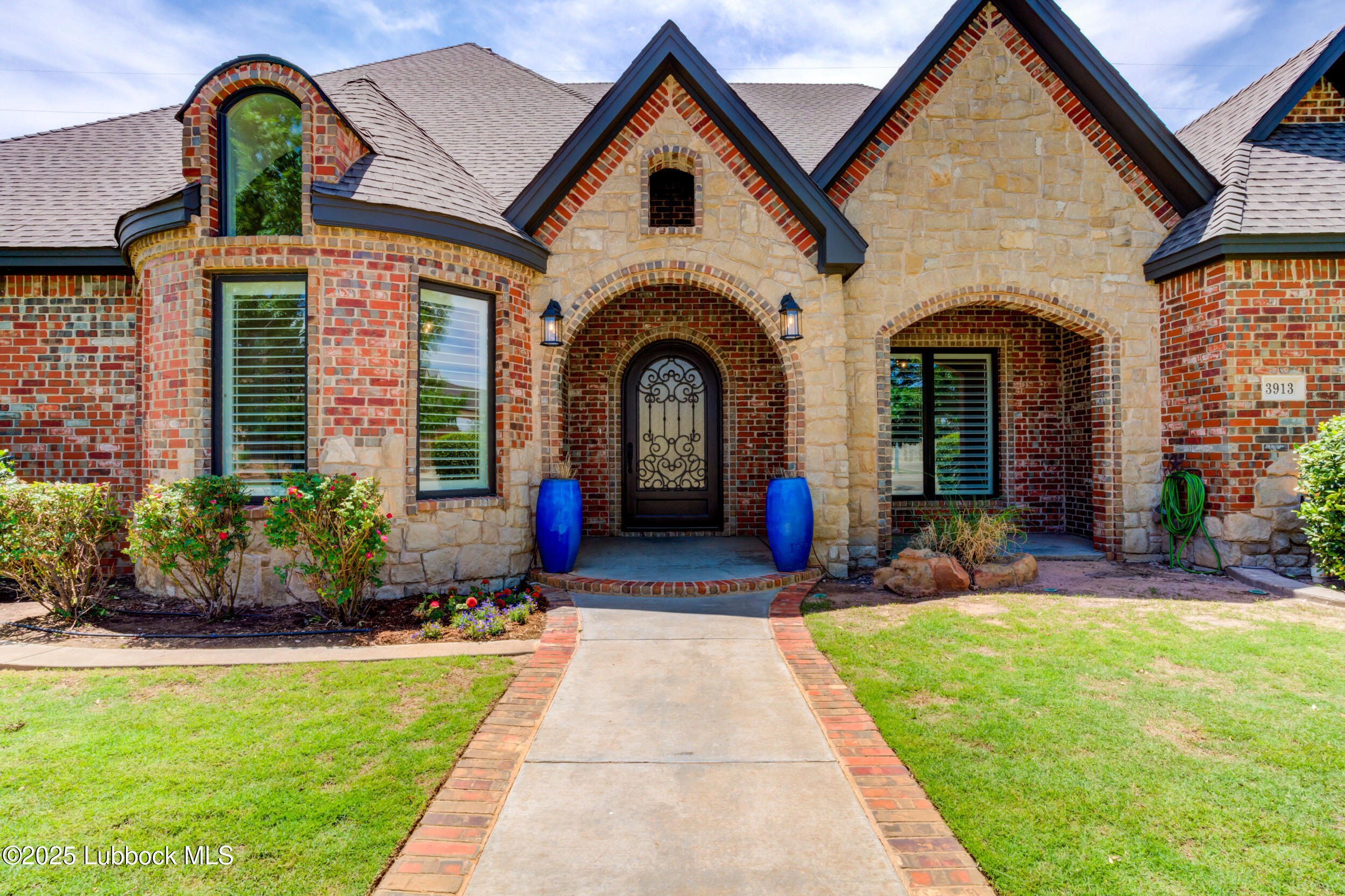 3913 106th Street Lubbock, TX 79423 - Photo 11 of 80 a front view of a house with yard