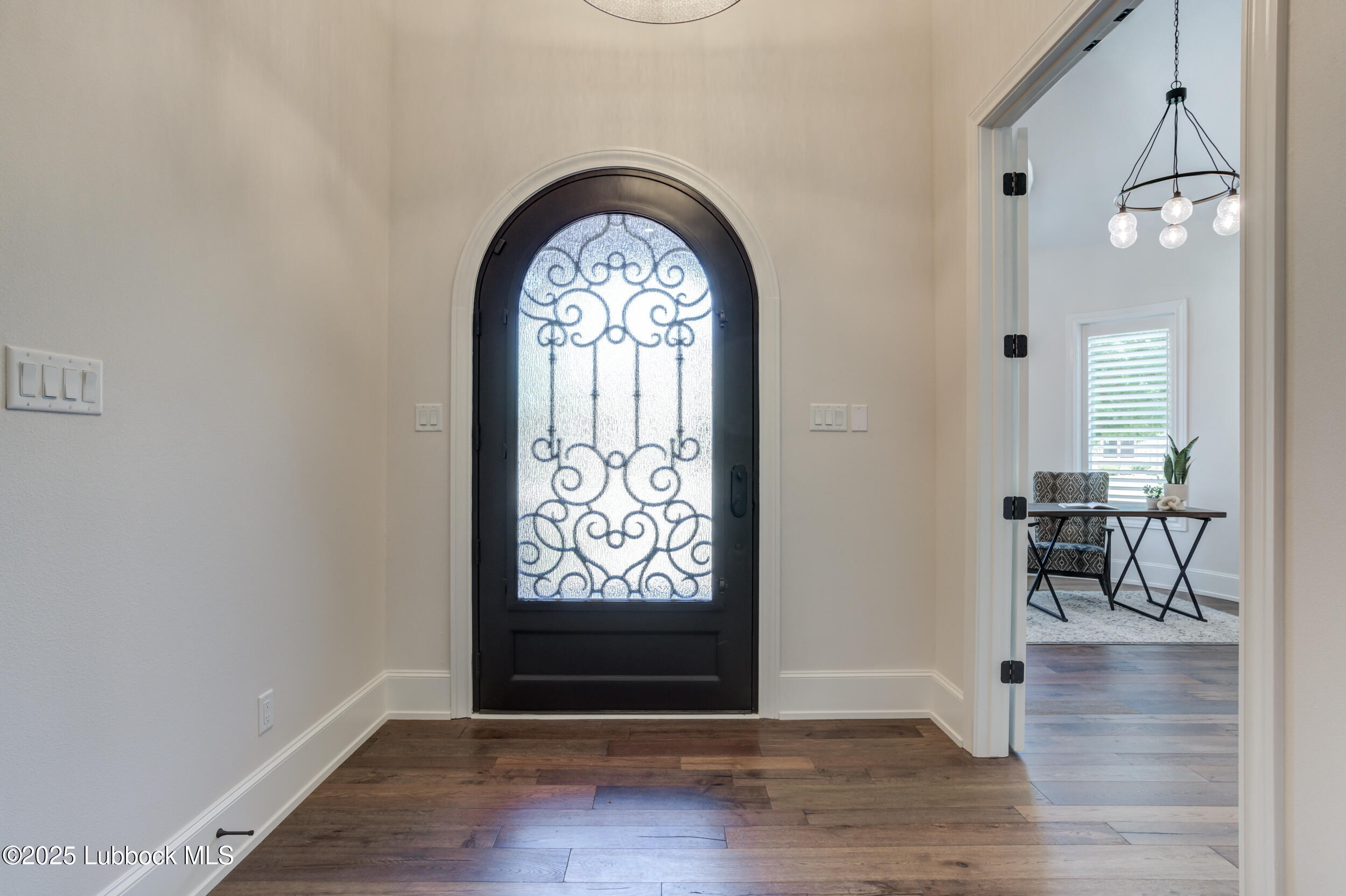 3913 106th Street Lubbock, TX 79423 - Photo 14 of 80 an empty room with wooden floor and windows