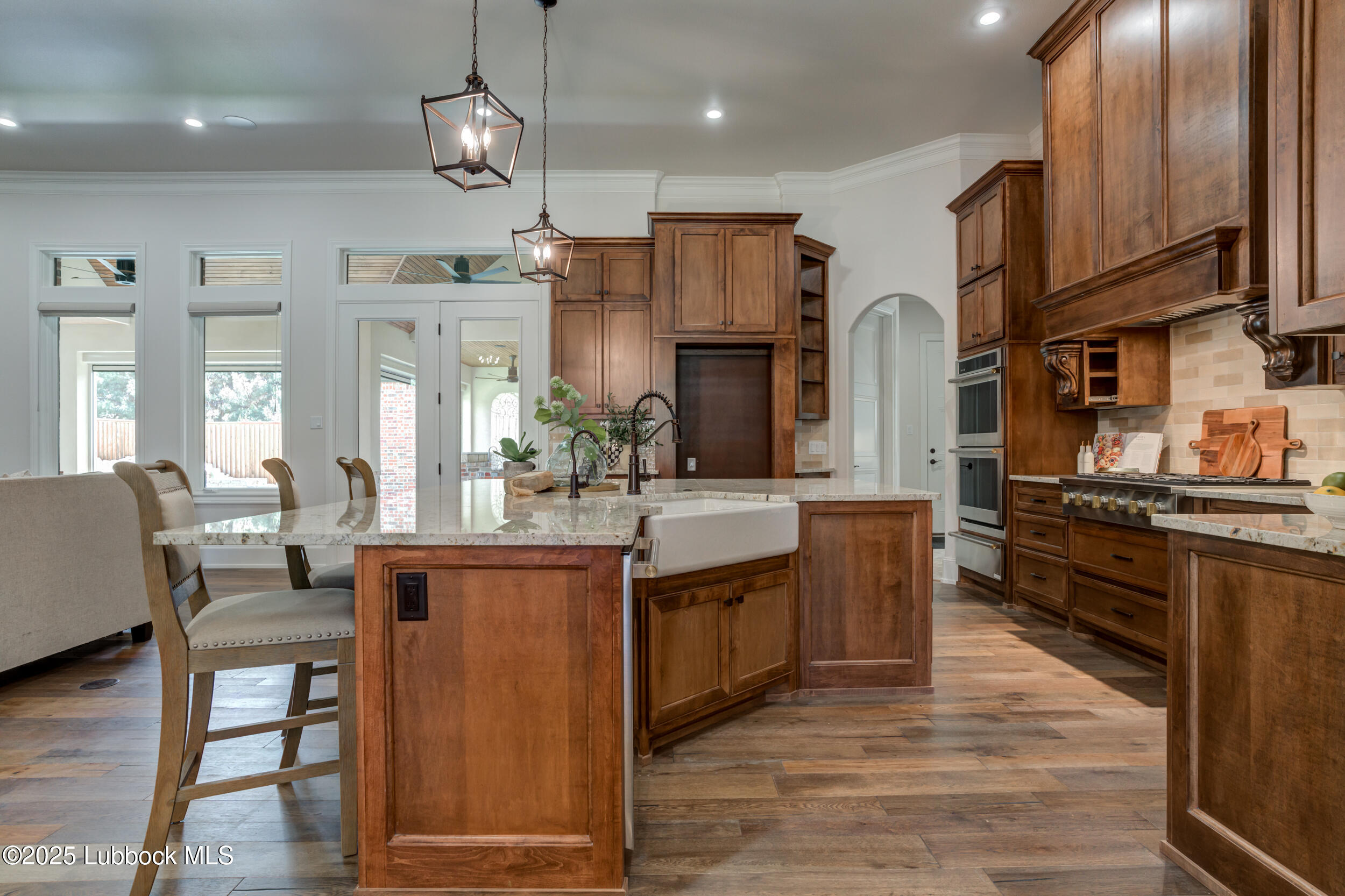 3913 106th Street Lubbock, TX 79423 - Photo 19 of 80 a kitchen with stainless steel appliances granite countertop a sink a stove and a refrigerator
