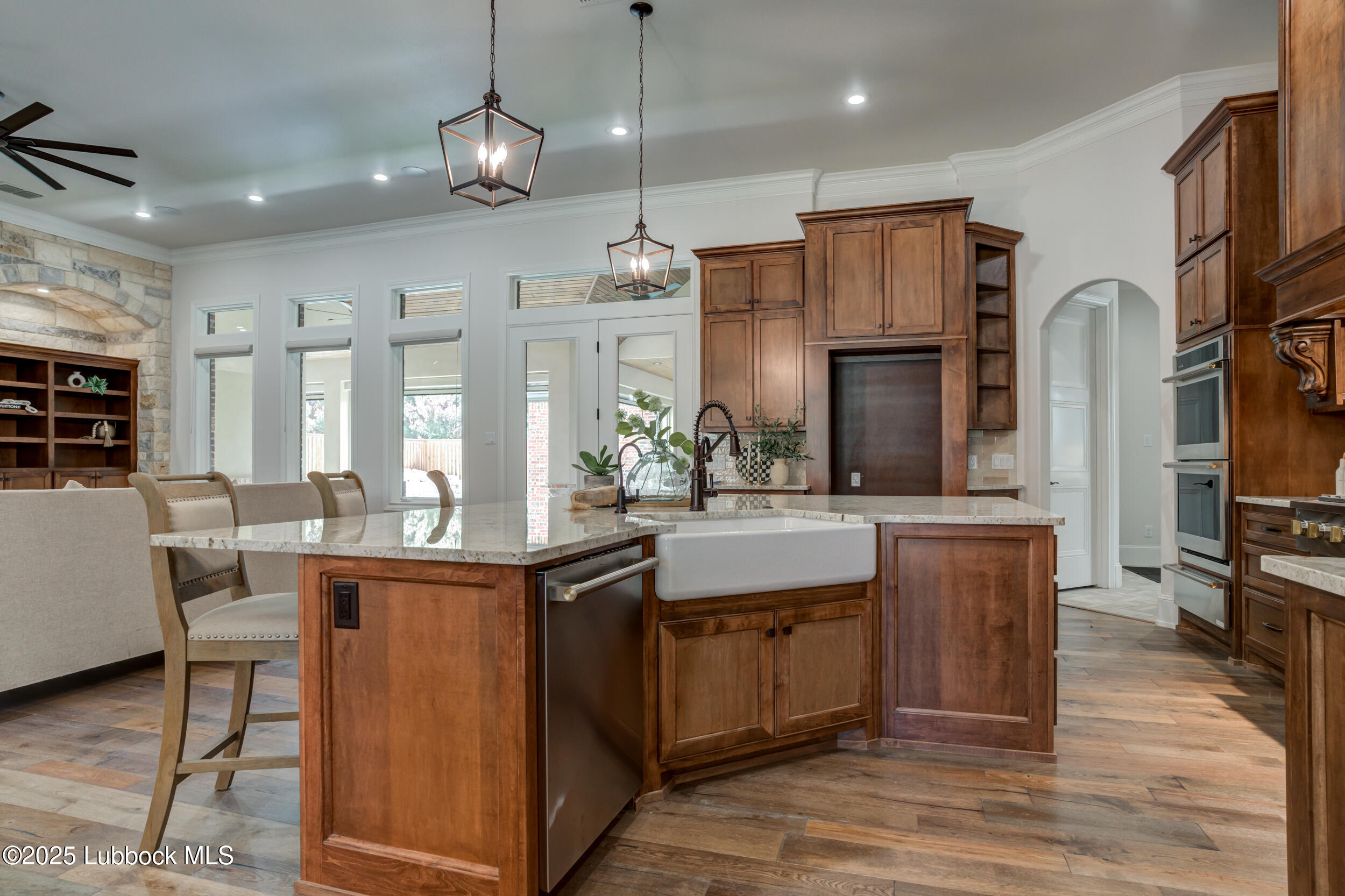 3913 106th Street Lubbock, TX 79423 - Photo 20 of 80 a kitchen with stainless steel appliances granite countertop a sink a stove and a refrigerator