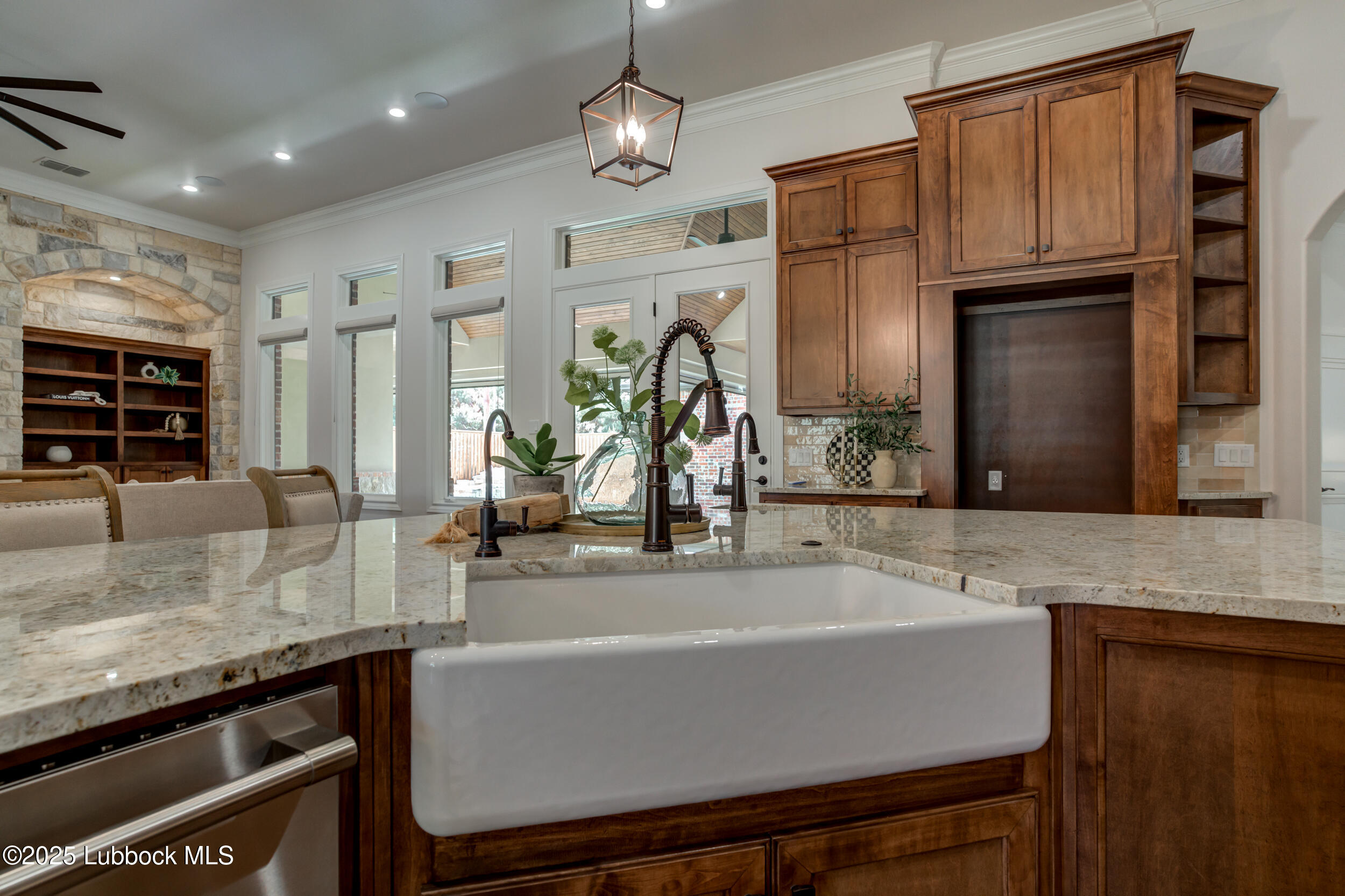 3913 106th Street Lubbock, TX 79423 - Photo 22 of 80 a kitchen with stainless steel appliances granite countertop a sink and a refrigerator