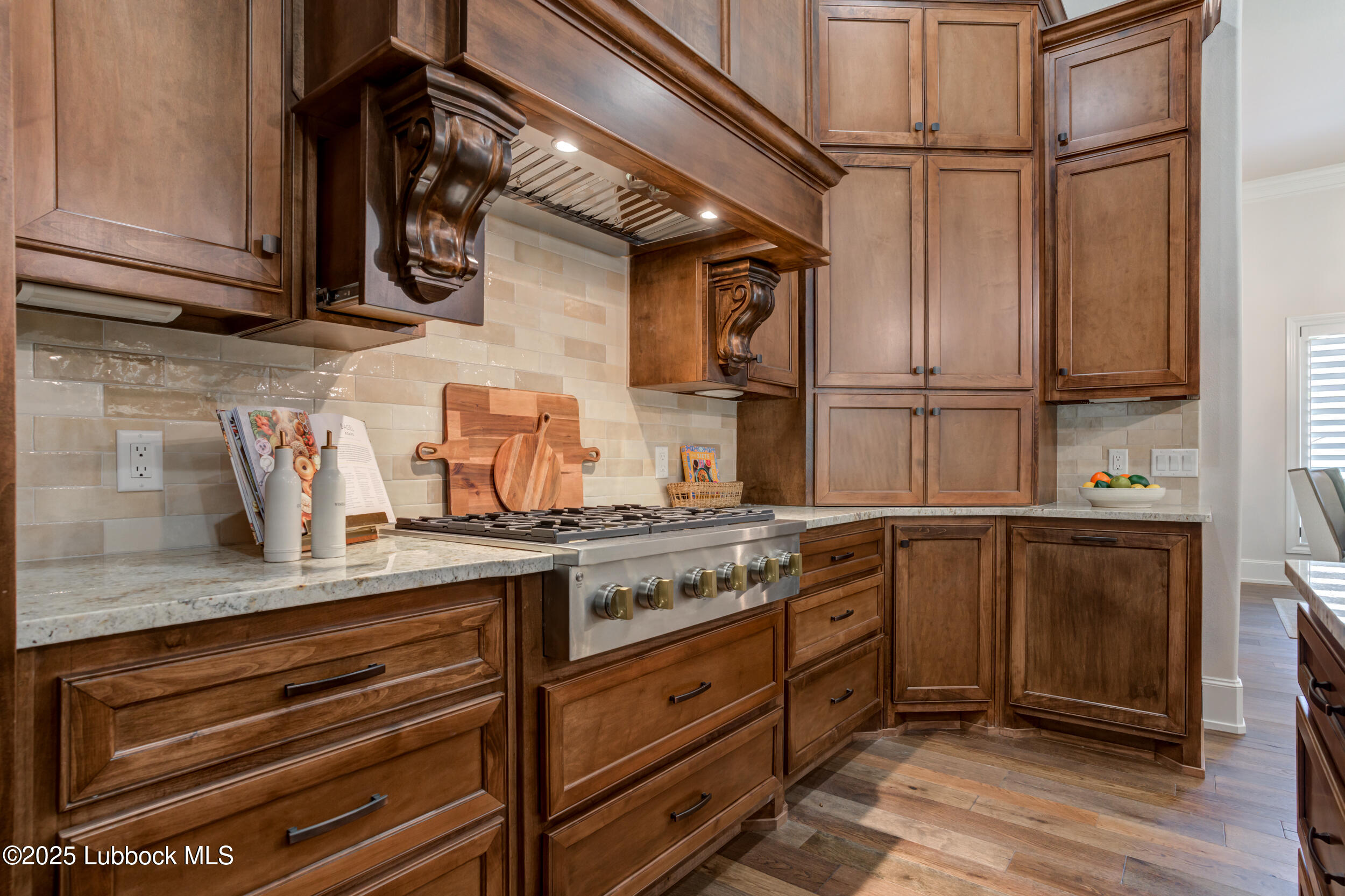 3913 106th Street Lubbock, TX 79423 - Photo 23 of 80 a kitchen with stainless steel appliances granite countertop a sink a stove and cabinets