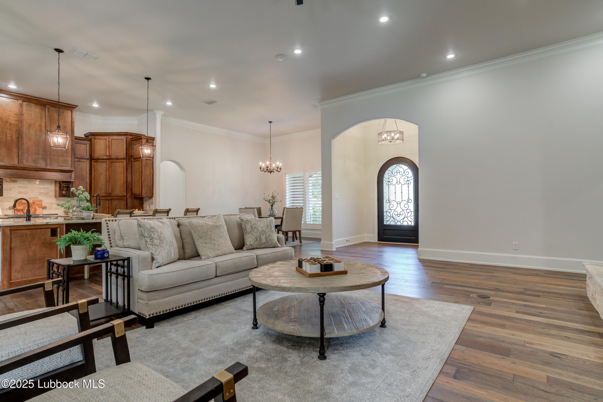 3913 106th Street Lubbock, TX 79423 - Photo 29 of 80 a living room with furniture a rug and white walls