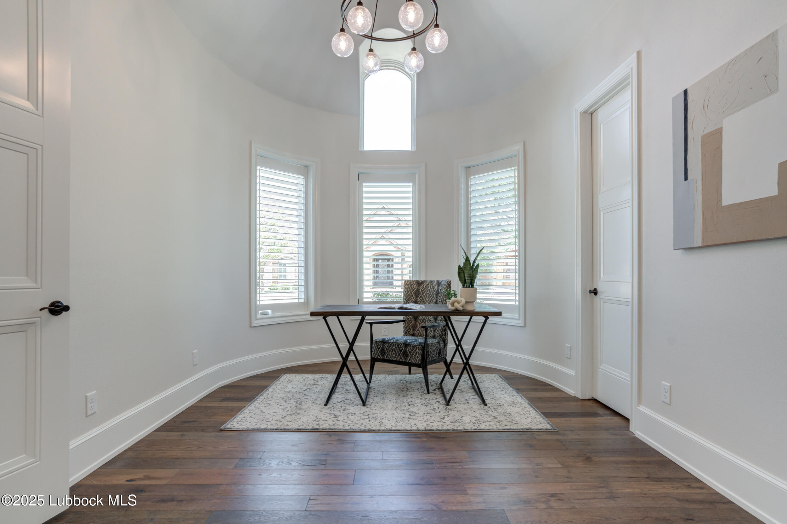3913 106th Street Lubbock, TX 79423 - Photo 41 of 80 a view of a dining room with furniture window and wooden floor