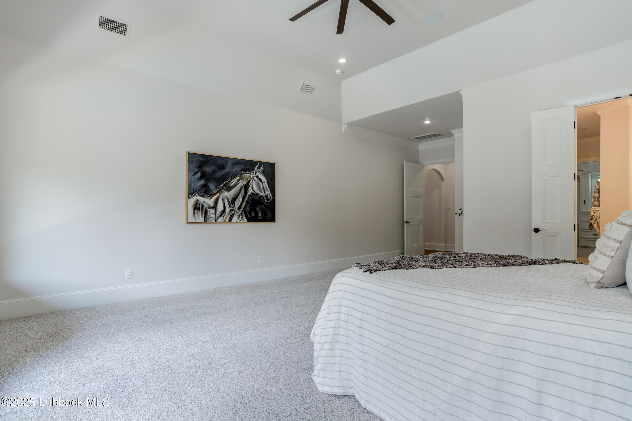 3913 106th Street Lubbock, TX 79423 - Photo 50 of 80 a bedroom with a bed and a painting on the wall