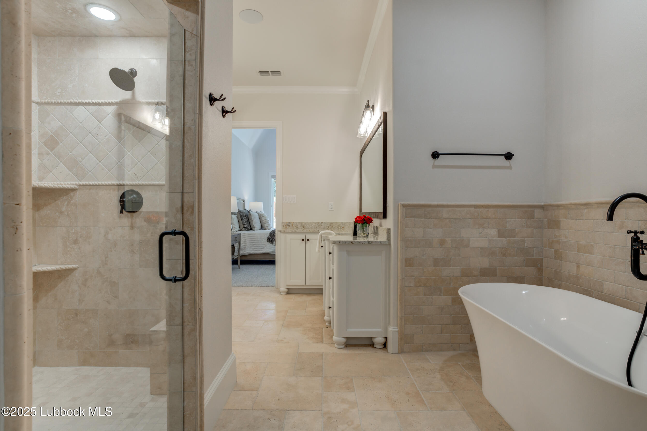 3913 106th Street Lubbock, TX 79423 - Photo 54 of 80 a bathroom with a tub and a shower
