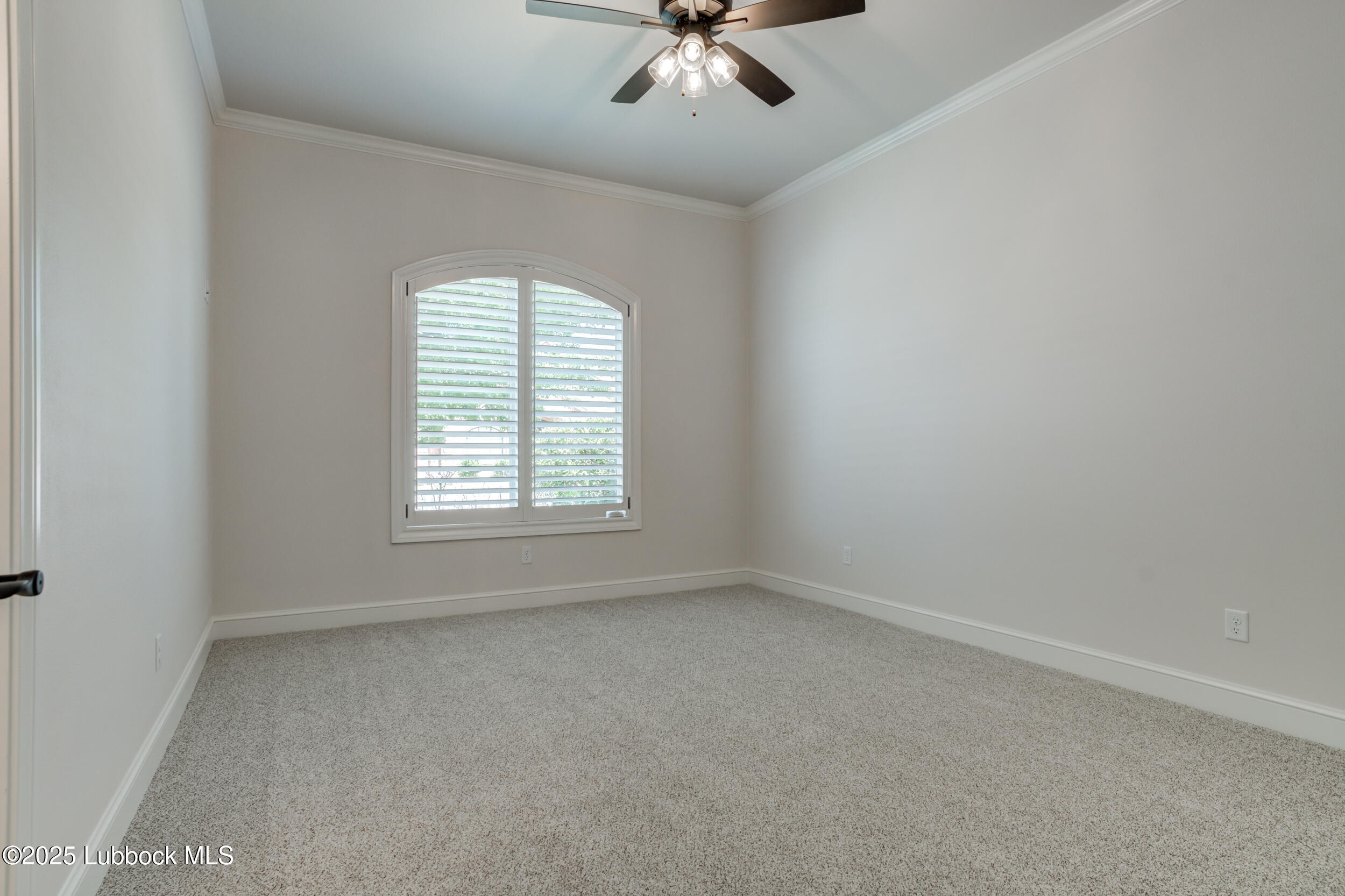 3913 106th Street Lubbock, TX 79423 - Photo 63 of 80 an empty room with a window and a fan