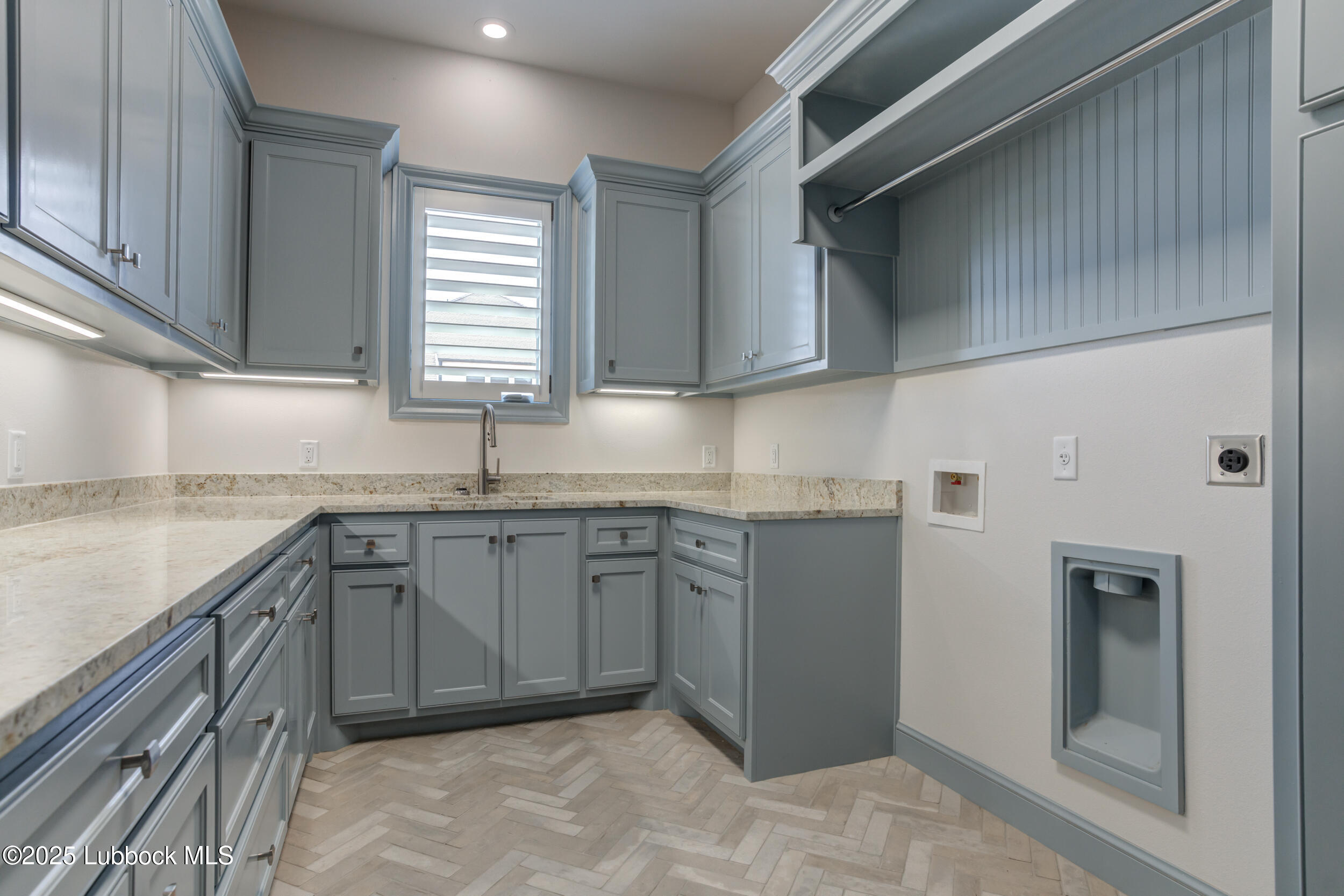 3913 106th Street Lubbock, TX 79423 - Photo 72 of 80 a kitchen with granite countertop a sink stainless steel appliances and cabinets