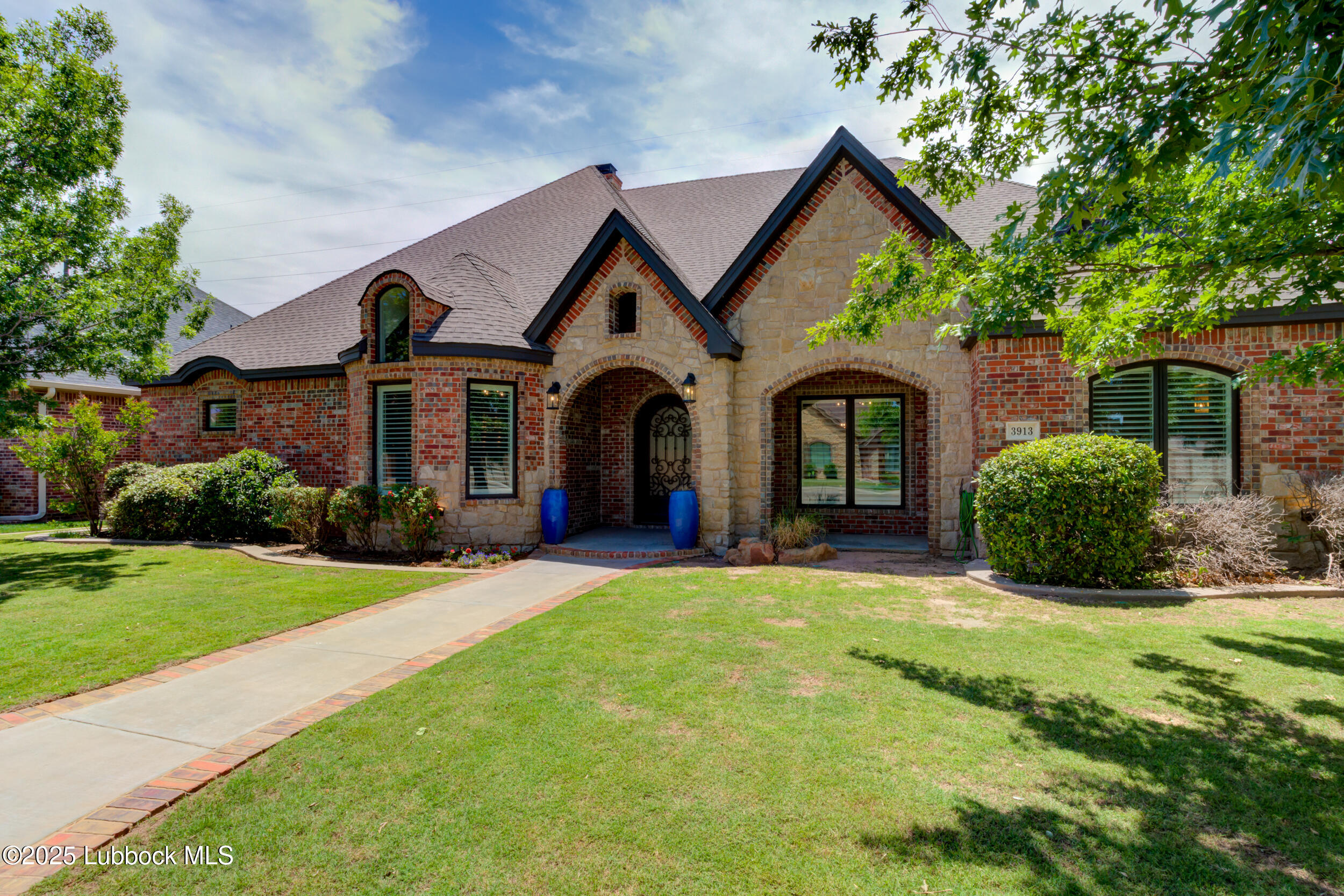 3913 106th Street Lubbock, TX 79423 - Photo 9 of 80 a front view of a house with yard and green space