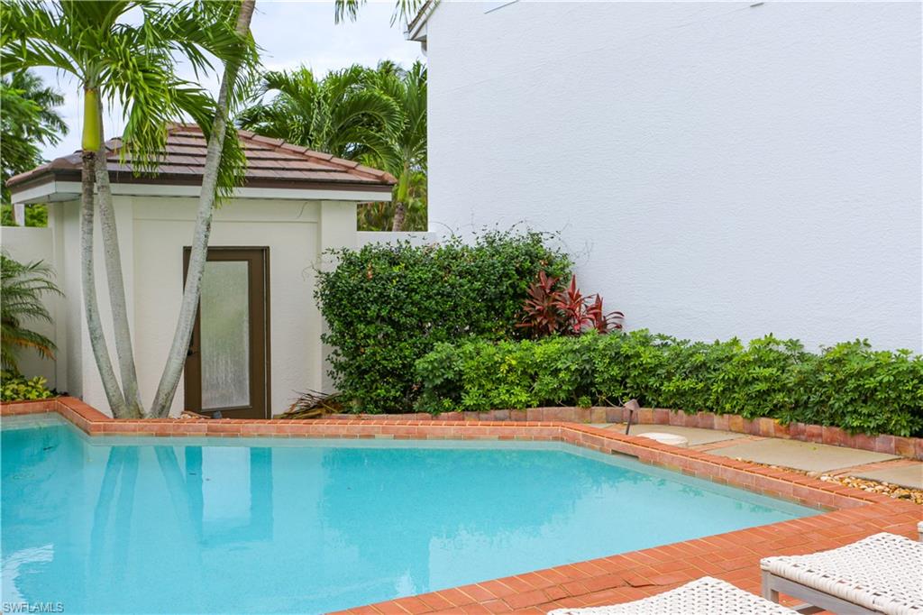 1136 6th Street South, Unit 5 Naples, FL 34102 - Photo 11 of 50 a view of a backyard