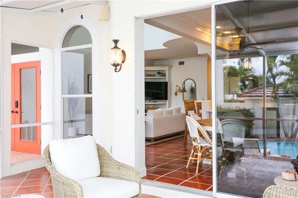 1136 6th Street South, Unit 5 Naples, FL 34102 - Photo 30 of 50 a living room filled with furniture