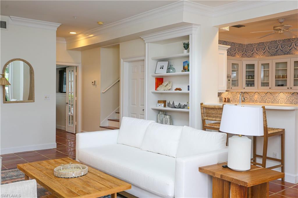 1136 6th Street South, Unit 5 Naples, FL 34102 - Photo 3 of 50 a living room with furniture and a wooden floor