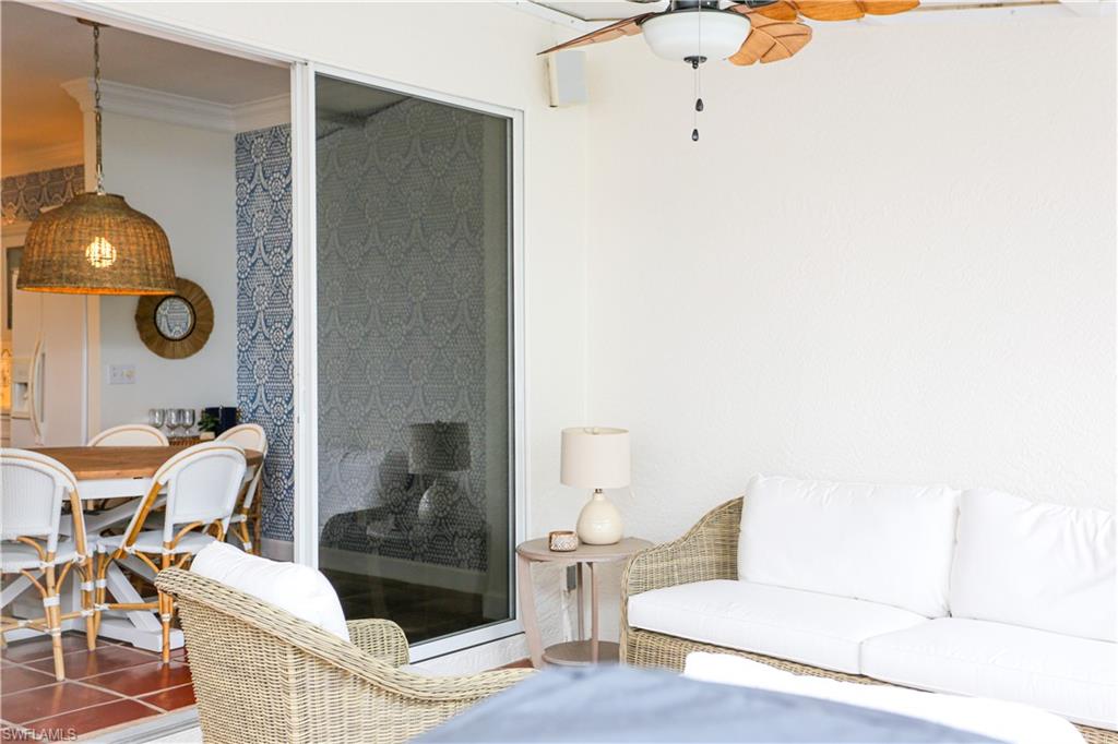 1136 6th Street South, Unit 5 Naples, FL 34102 - Photo 31 of 50 a living room with couches and a potted plant