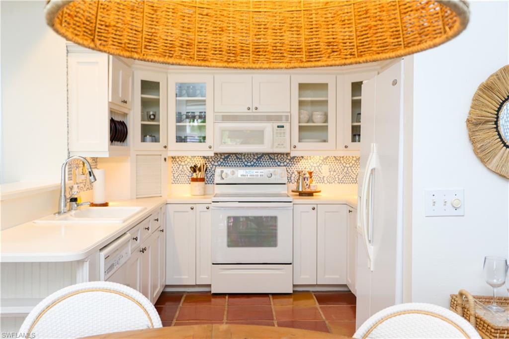 1136 6th Street South, Unit 5 Naples, FL 34102 - Photo 40 of 50 a bathroom with a sink a mirror and a shower