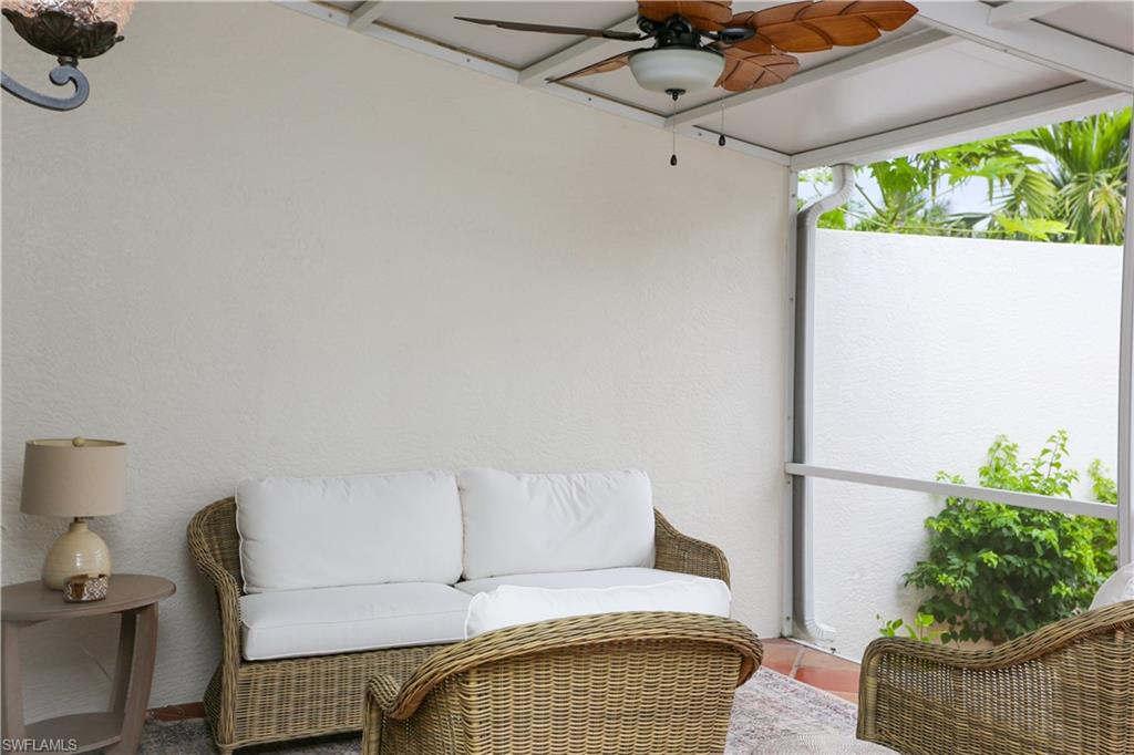 1136 6th Street South, Unit 5 Naples, FL 34102 - Photo 45 of 50 a living room with furniture and a potted plant