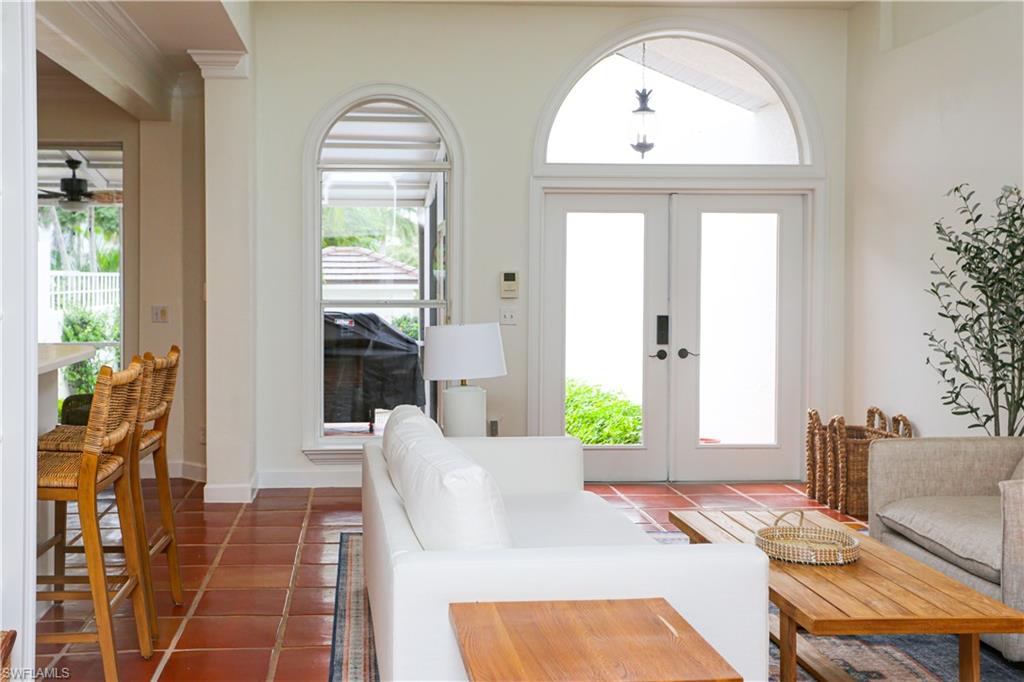1136 6th Street South, Unit 5 Naples, FL 34102 - Photo 49 of 50 a living room with furniture and a window