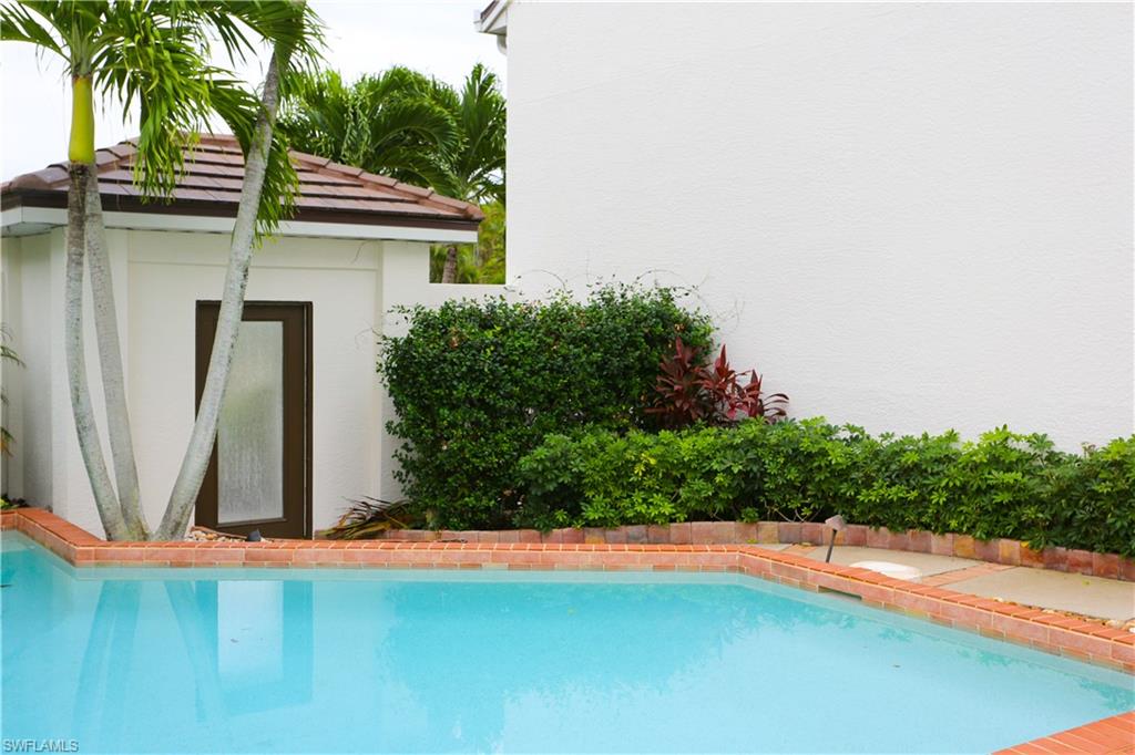 1136 6th Street South, Unit 5 Naples, FL 34102 - Photo 6 of 50 an outdoor space with pool and furniture