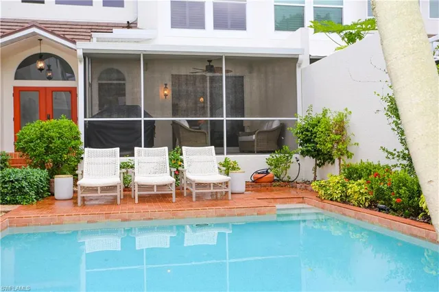 a view of a chairs and table in the patio