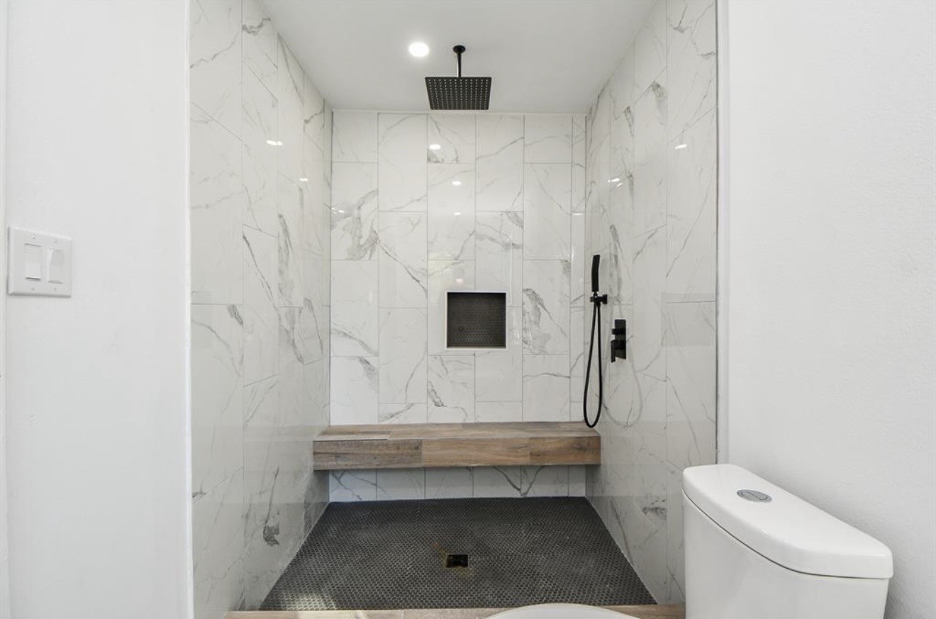 6834 St Augustine Street Houston, TX 77021 - Photo 10 of 21 a bathroom with a toilet and a shower