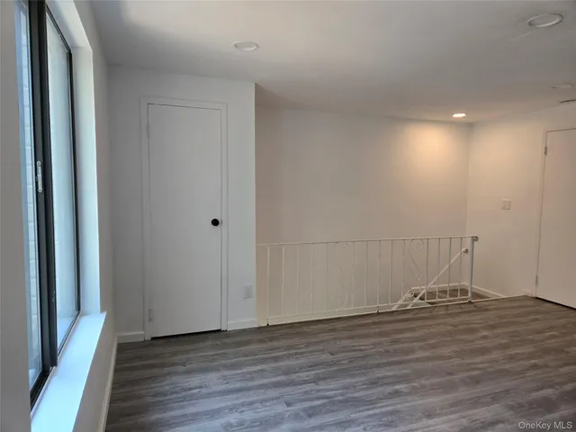 a view of a livingroom with wooden floor