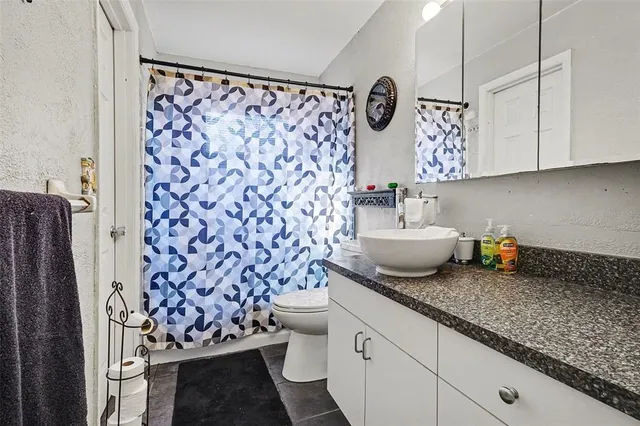 a kitchen with a refrigerator and a stove