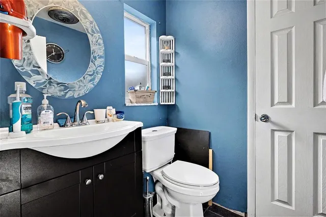 a bedroom with double bunk beds and a ceiling fan