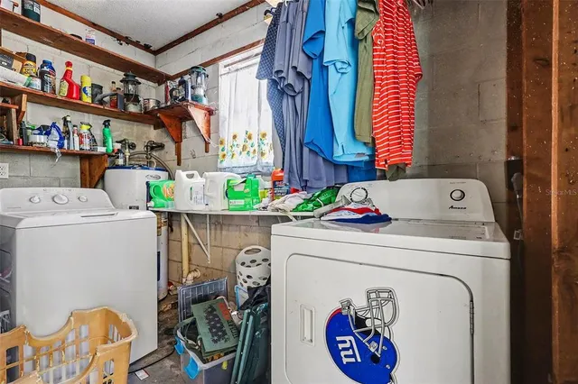 a view of a patio with a dining table and chairs