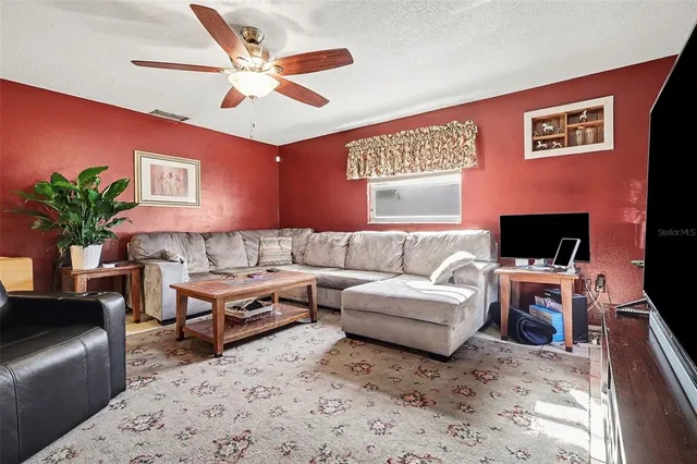 a kitchen with stainless steel appliances a sink a stove a refrigerator and cabinets